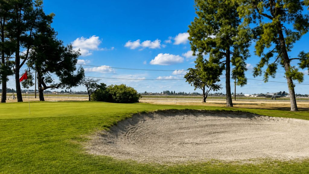 Golf green and sand bunker at Airways Golf Course in Fresno, California.