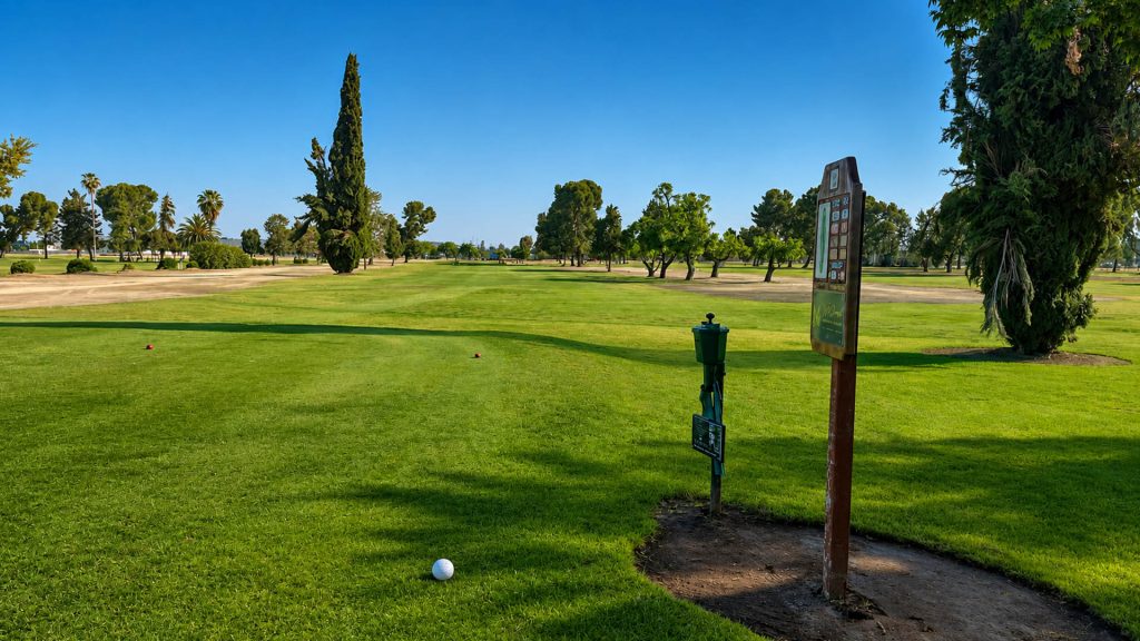 Teeing area overlooking an open fairway at Airways Golf Course in Fresno.