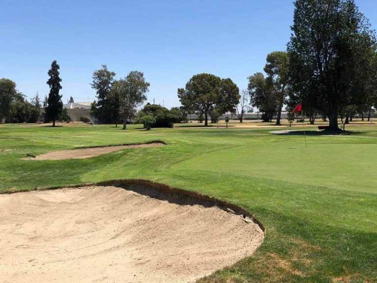 Golf green and sand bunker at Airways Golf Course in Fresno, California.