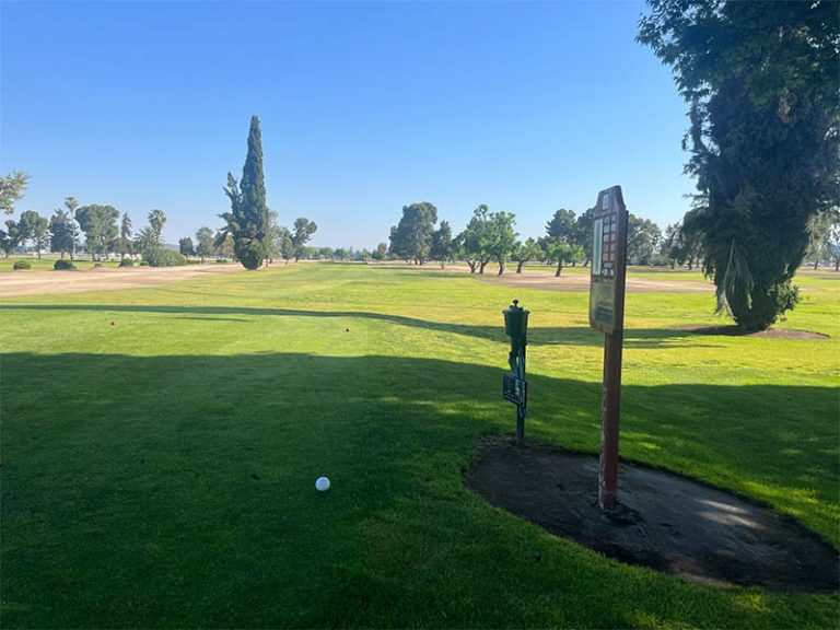Teeing area overlooking an open fairway at Airways Golf Course in Fresno.