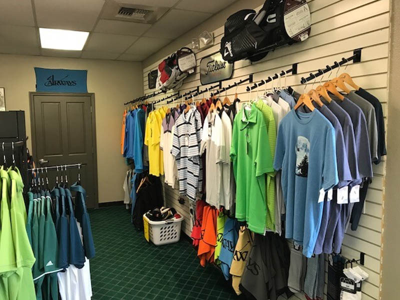 Golf apparel and accessories displayed inside the Airways Golf Course pro shop.